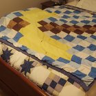 I was at my grandma's house a bit ago and found this quilt of a gold pickaxe.