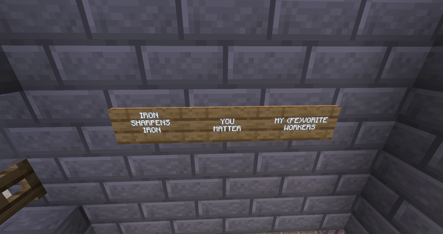 I put some motivational posters in my village's Iron Farm to boost morale and worker productivity.