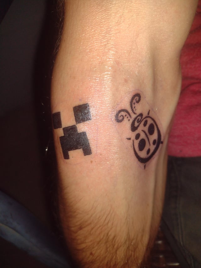 I don't care for Minecraft myself but my son loves it so I got a Minecraft tattoo. (That's his little sister Kay D Bug next to him). He was pumped. 