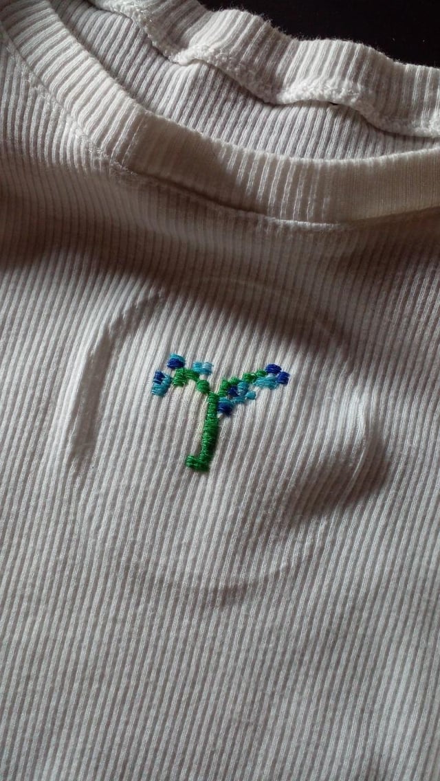 I embroidered this flower on my shirt.